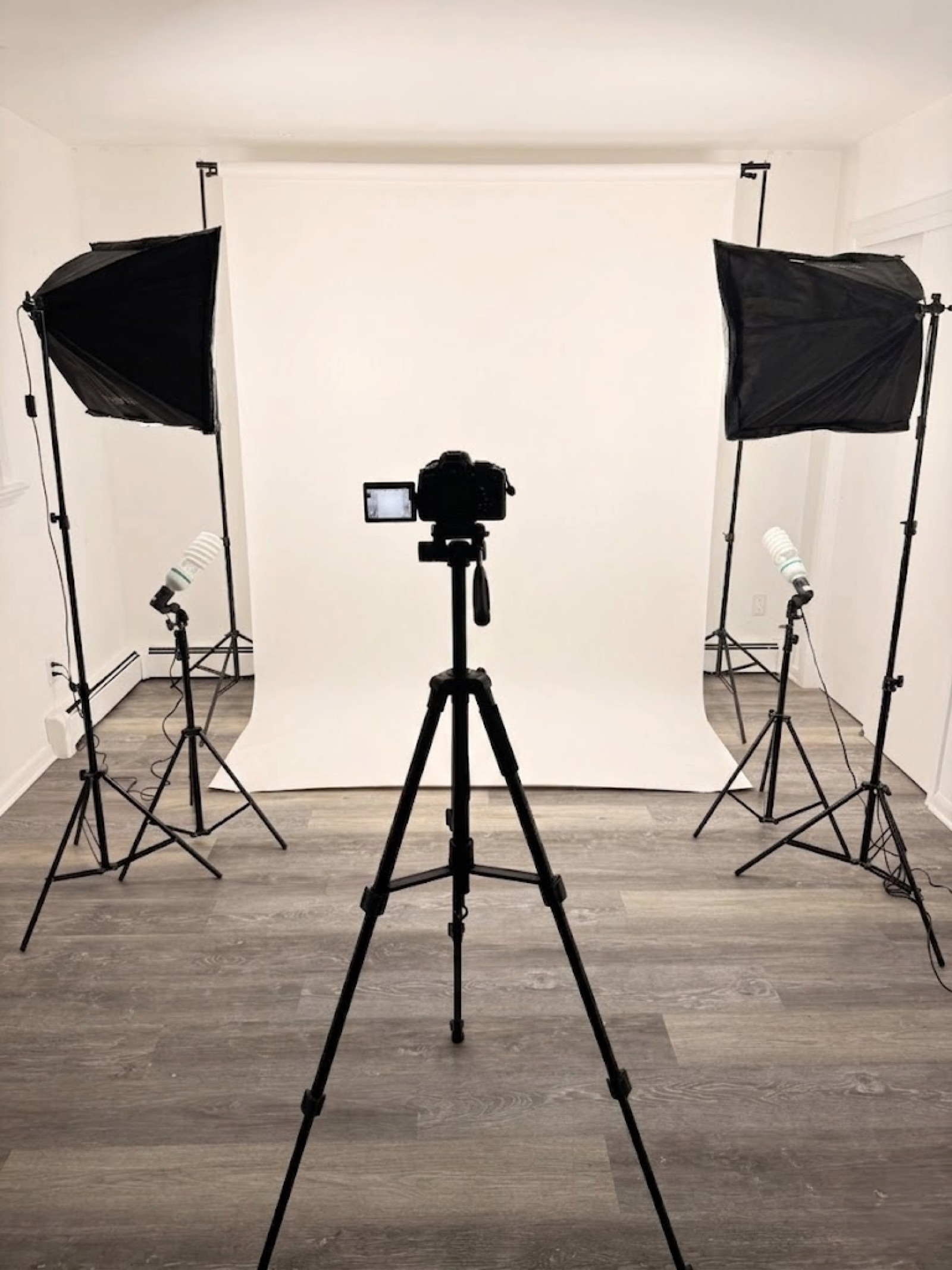 Studio setup with white backdrop and professional lighting
